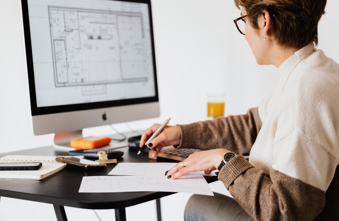 crop estate agent working with computer in office